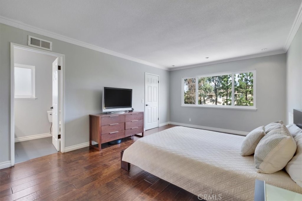 2232 Montague Circle Placentia, CA 92870 - Photo 22 of 36 a bedroom with a bed and a flat screen tv