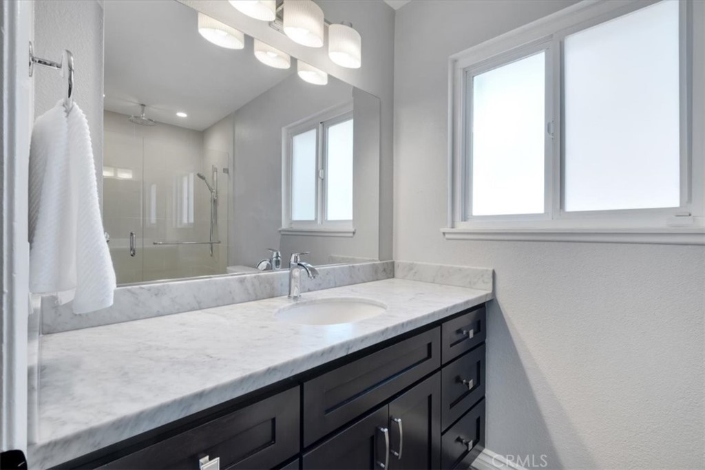 2232 Montague Circle Placentia, CA 92870 - Photo 24 of 36 a bathroom with a sink a vanity and a mirror