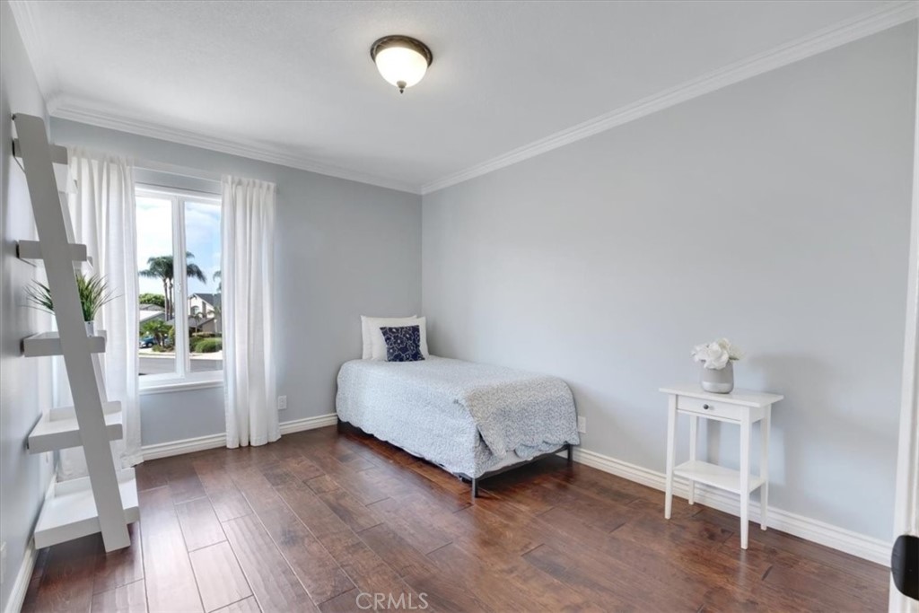 2232 Montague Circle Placentia, CA 92870 - Photo 27 of 36 a living room with a bed furniture and a window