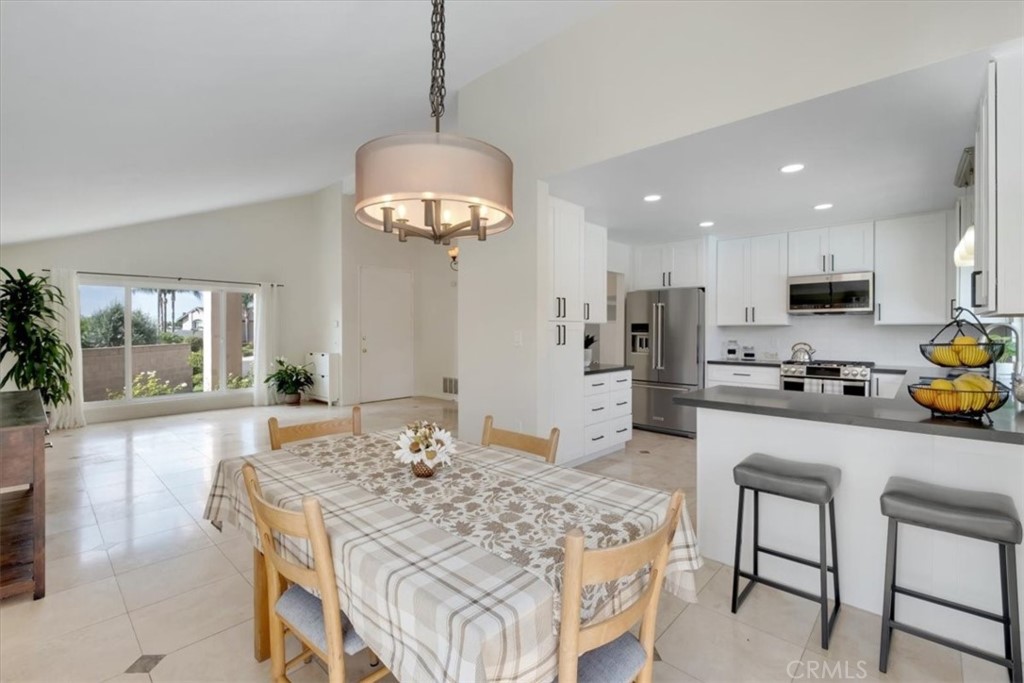 2232 Montague Circle Placentia, CA 92870 - Photo 4 of 36 a kitchen with kitchen island granite countertop a center island and appliances