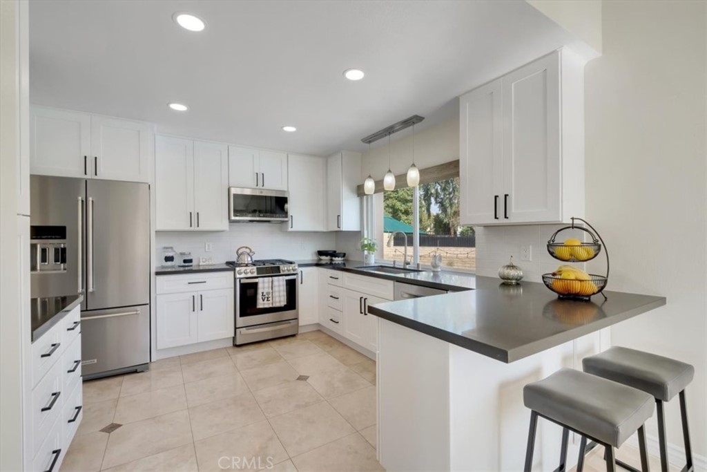 2232 Montague Circle Placentia, CA 92870 - Photo 8 of 36 a kitchen with a sink appliances and cabinets