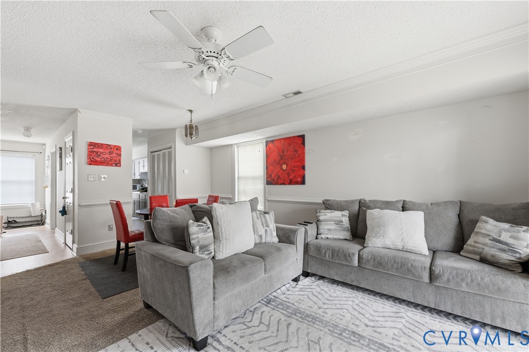161 Lakeview Park Road Colonial Heights, VA 23834 - Photo 12 of 20 a living room with furniture and a chandelier