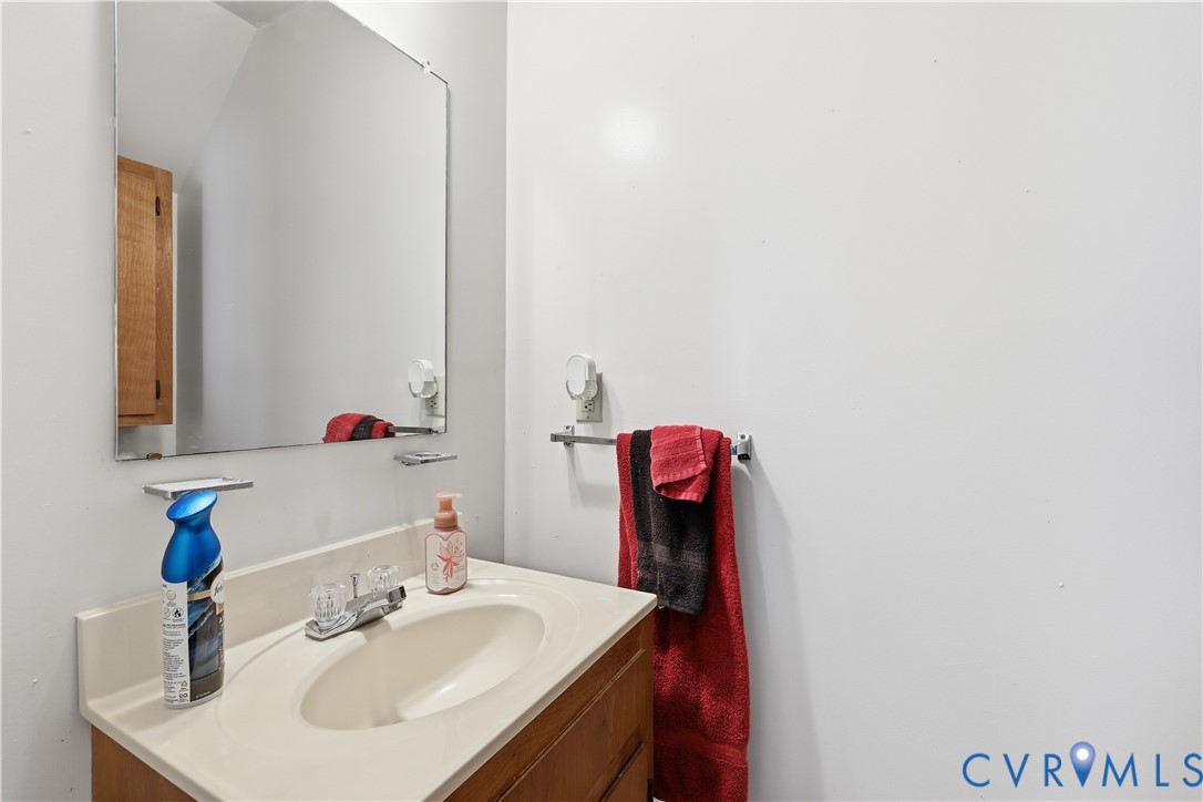 161 Lakeview Park Road Colonial Heights, VA 23834 - Photo 14 of 20 a bathroom with a sink and a mirror