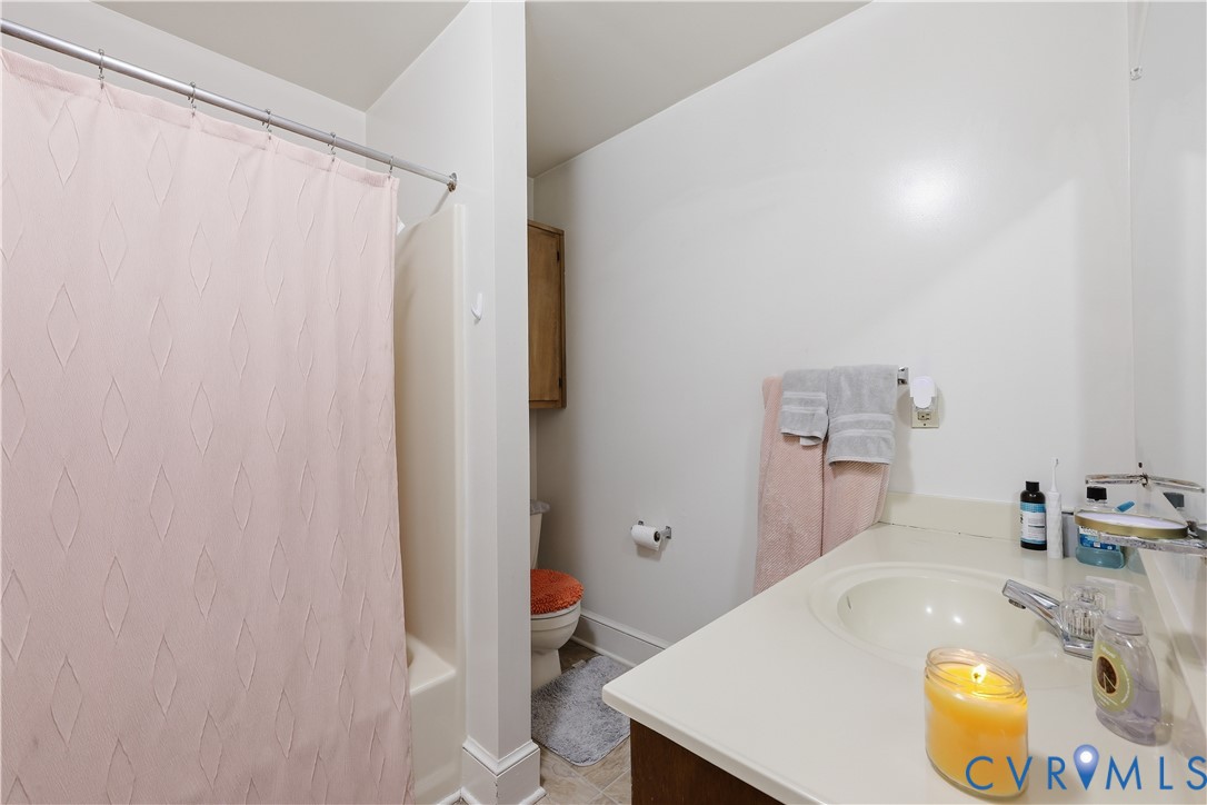 161 Lakeview Park Road Colonial Heights, VA 23834 - Photo 18 of 20 a bathroom with a sink and a mirror