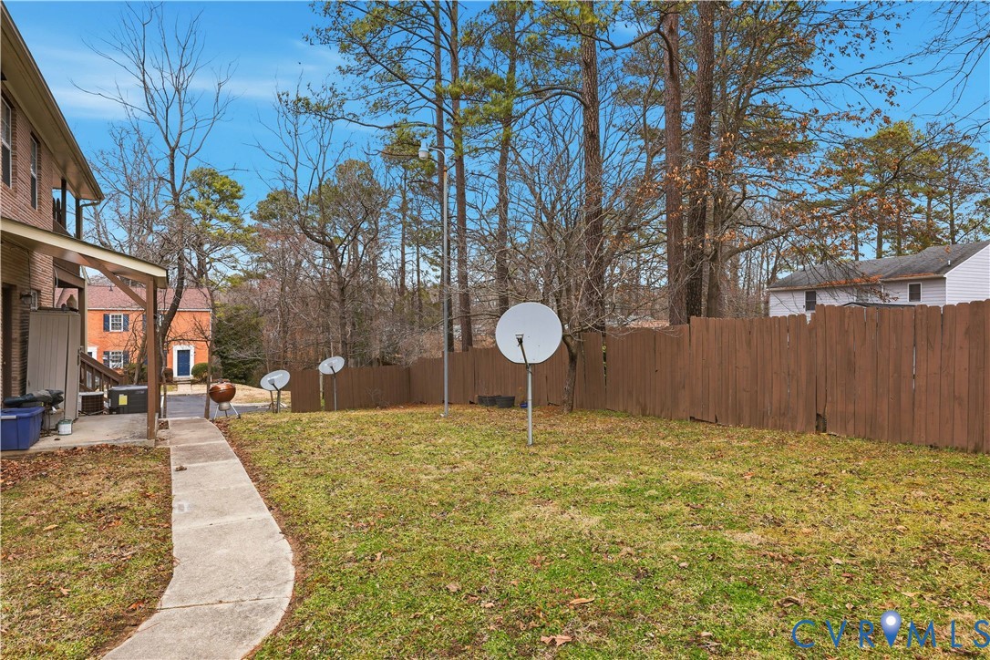 161 Lakeview Park Road Colonial Heights, VA 23834 - Photo 3 of 20 a swimming pool with trees in front of it