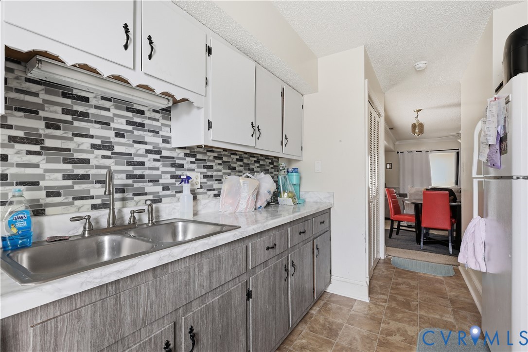 161 Lakeview Park Road Colonial Heights, VA 23834 - Photo 7 of 20 a kitchen with stainless steel appliances granite countertop a sink and a refrigerator