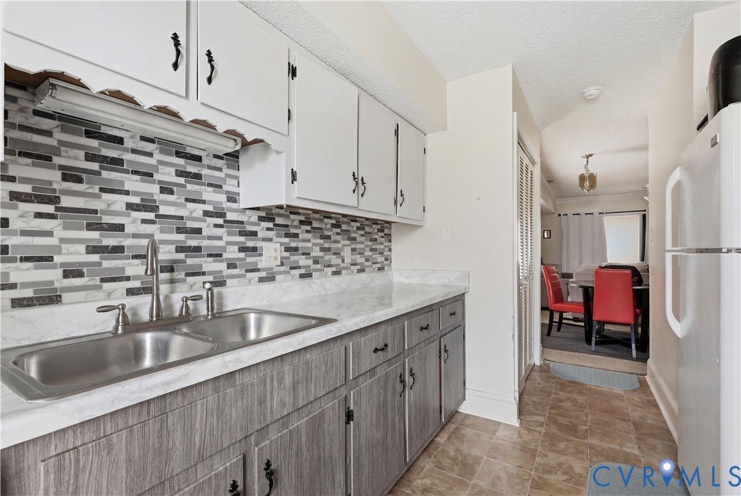 161 Lakeview Park Road Colonial Heights, VA 23834 - Photo 8 of 20 a kitchen with kitchen island a sink stainless steel appliances a counter top space and cabinets
