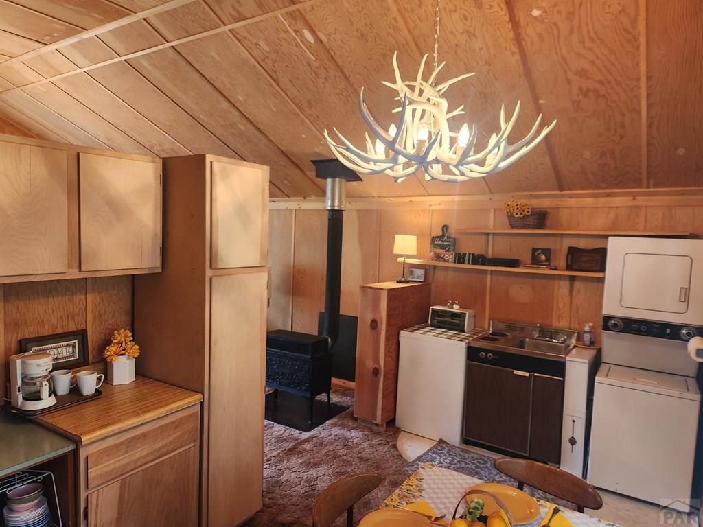 745 Konn Road Rye, CO 81069 - Photo 3 of 11 a kitchen with a refrigerator and a sink