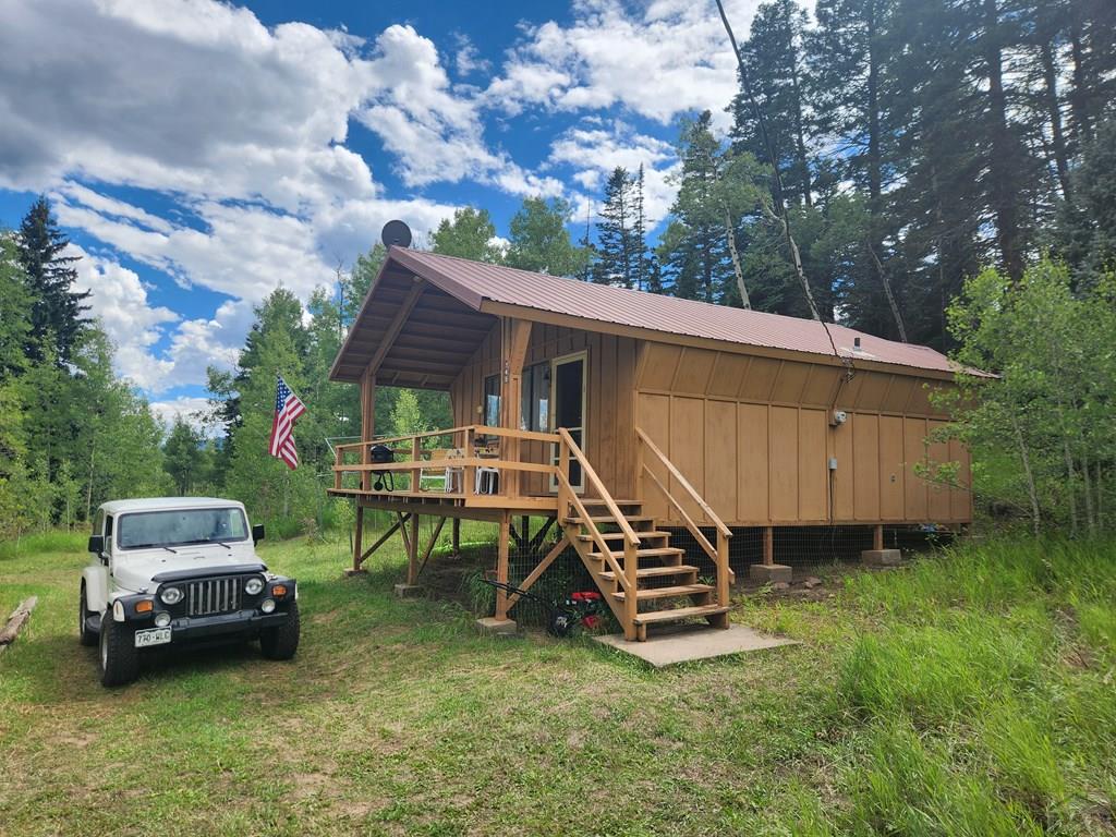 745 Konn Road Rye, CO 81069 - Photo 9 of 11 a backyard of a house with table and chairs