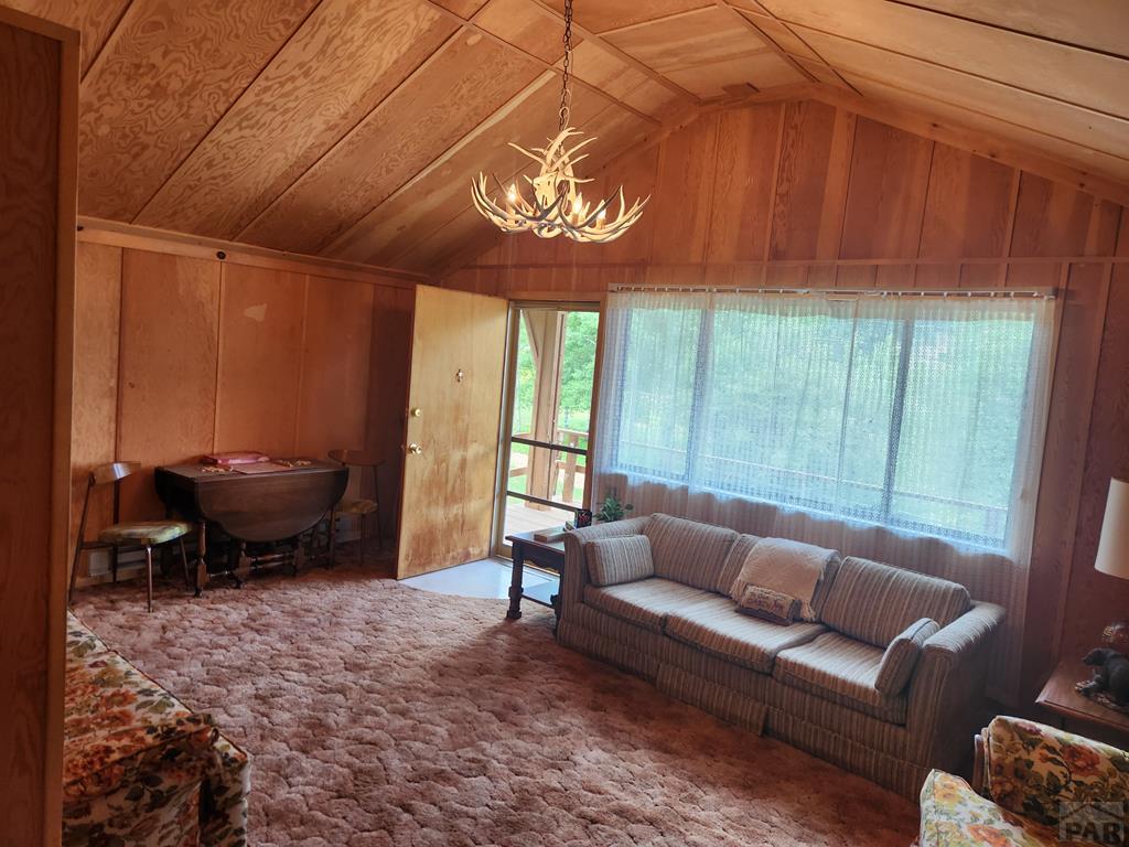745 Konn Road Rye, CO 81069 - Photo 10 of 11 a living room with furniture and a large window