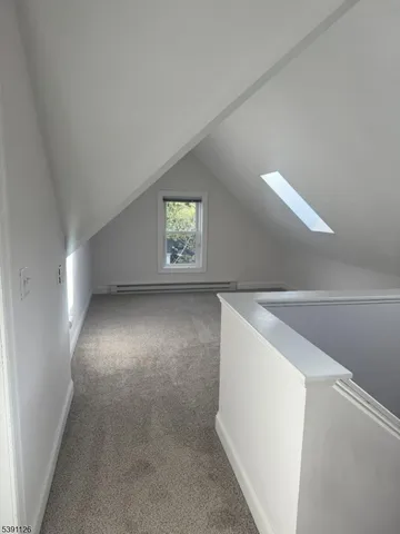 a view of empty room with windows