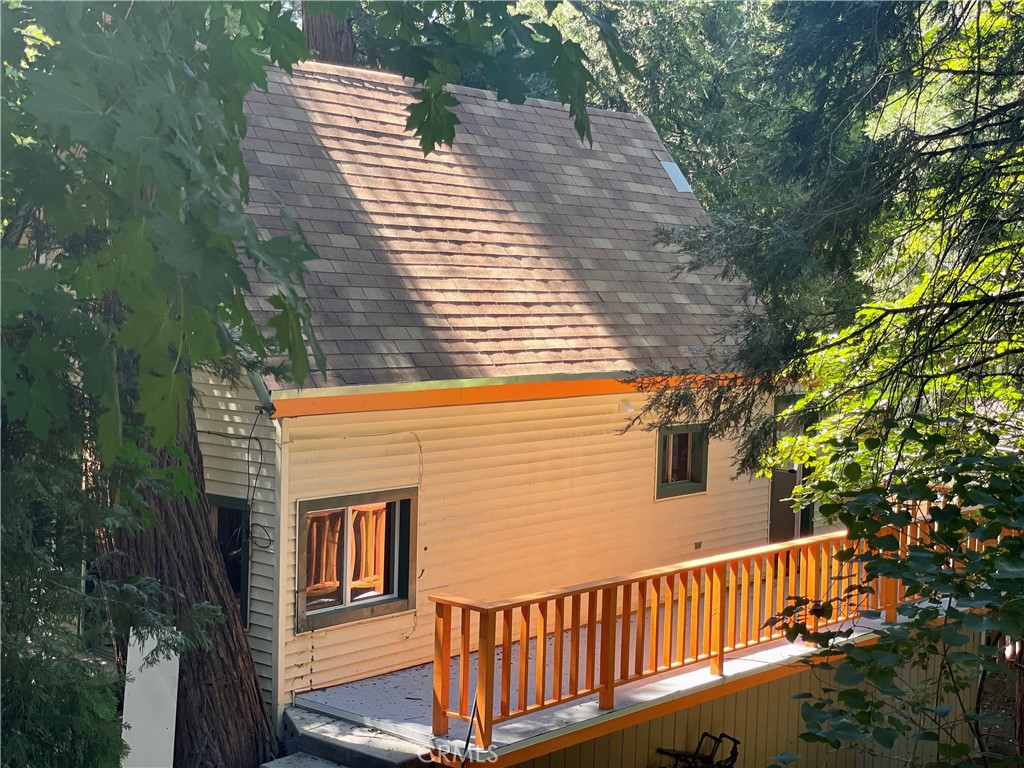 719 Woodland Road Crestline, CA 92325 - Photo 2 of 28 a view of a wooden deck