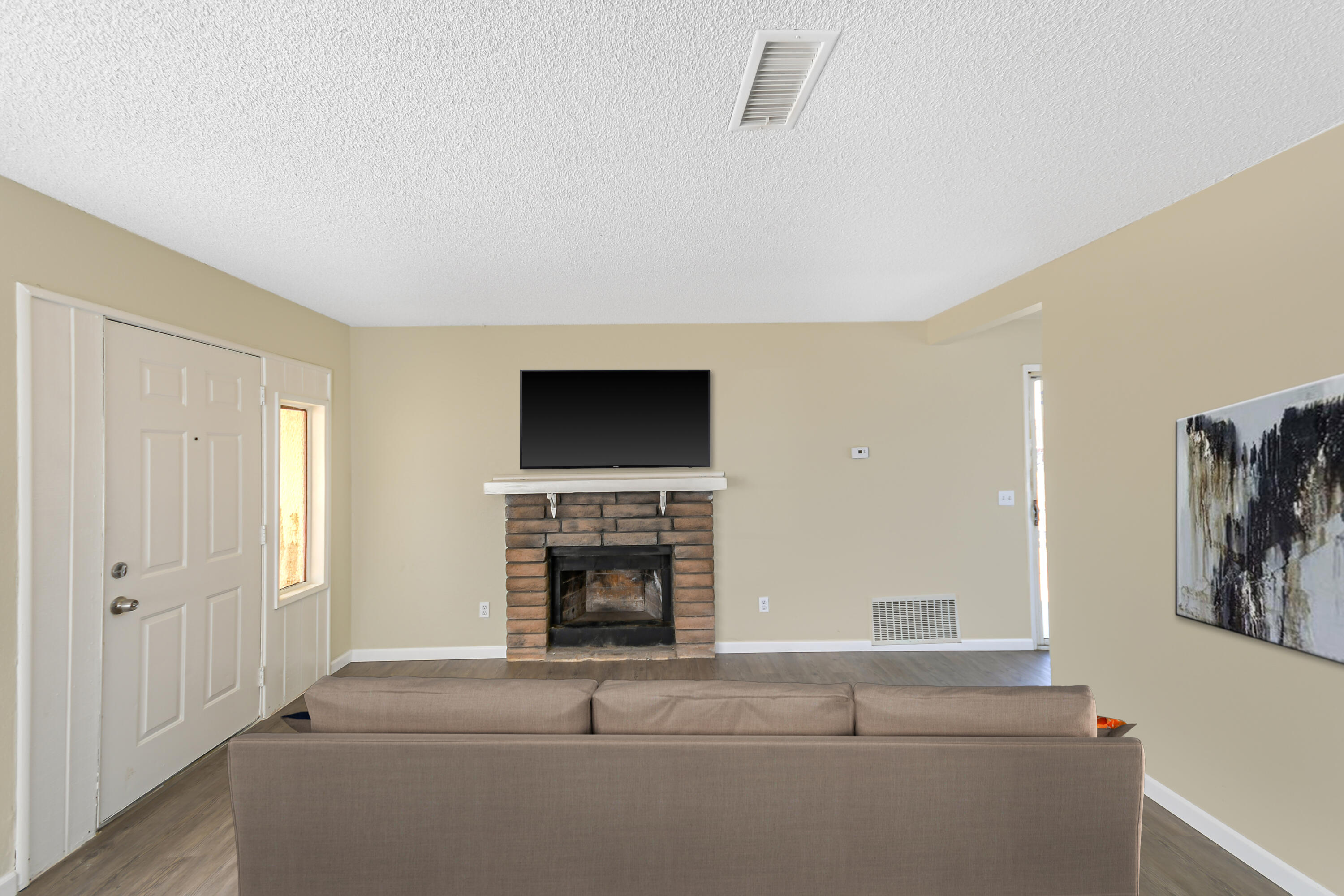 40611 178th Street East Lake Los Angeles, CA 93535 - Photo 5 of 14 a living room with furniture and a fireplace