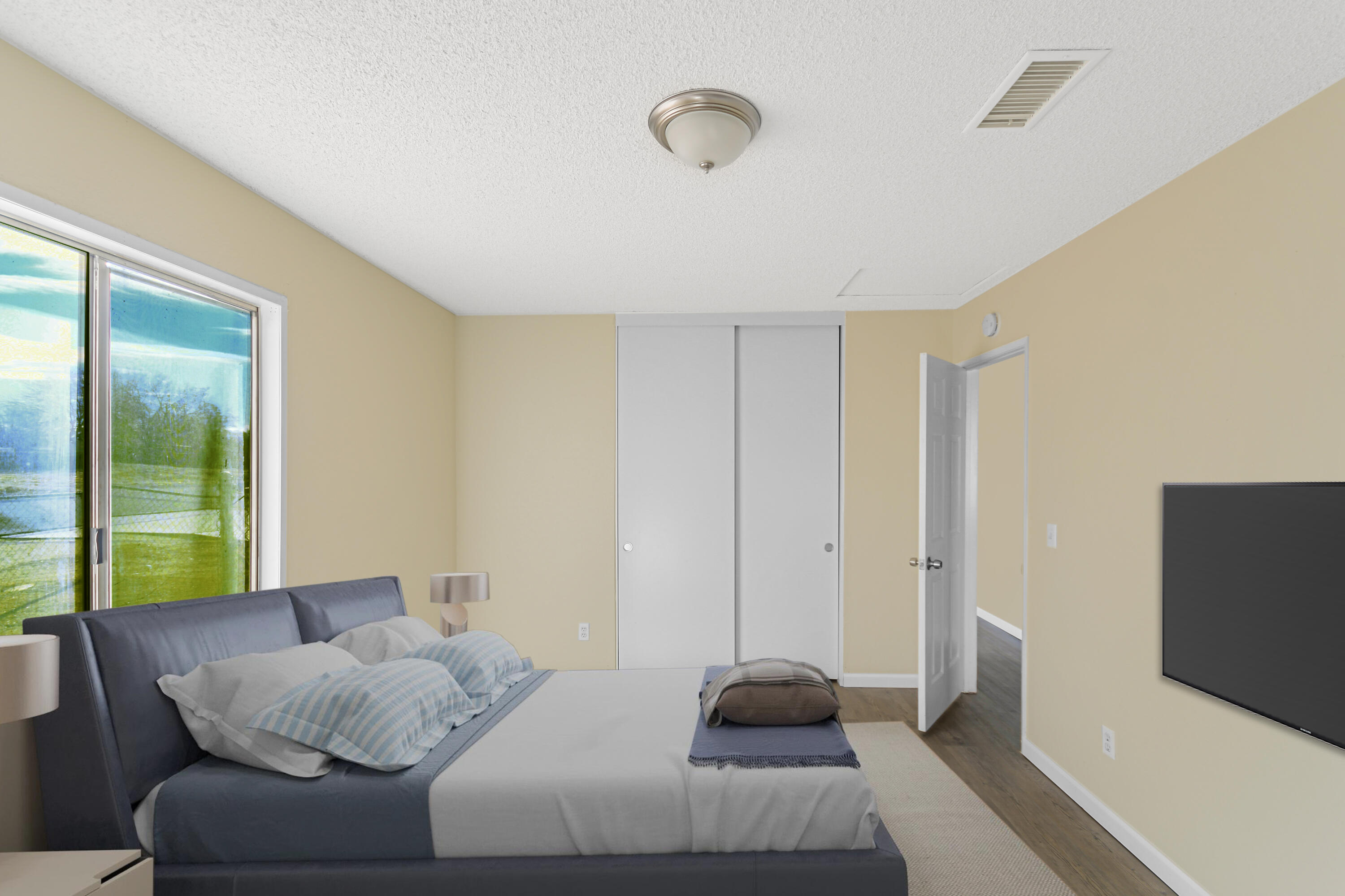40611 178th Street East Lake Los Angeles, CA 93535 - Photo 7 of 14 a bedroom with a bed and a flat screen tv