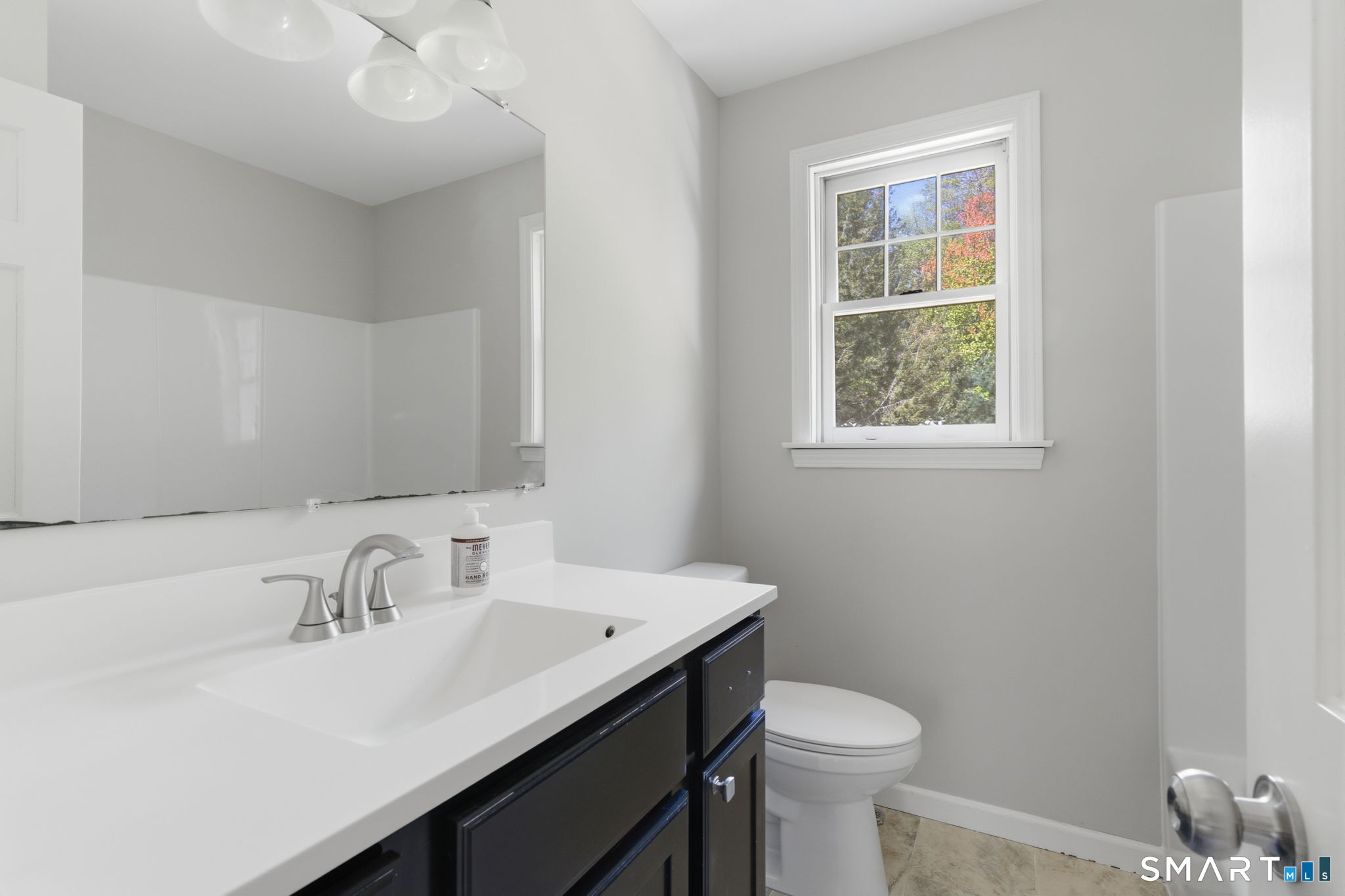 21 Greenwood Road North Granby, CT 06060 - Photo 29 of 40 a bathroom with a sink a toilet and a mirror