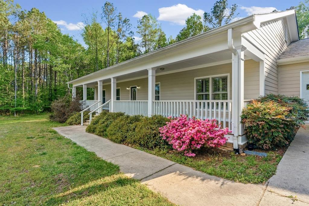 2239 Cross Roads Church Road Buchanan, GA 30113 - Photo 2 of 53 a front view of a house with garden