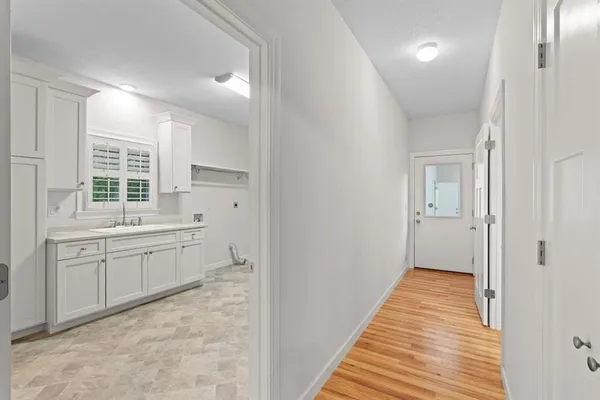 a spacious bathroom with a granite countertop sink mirror and a toilet