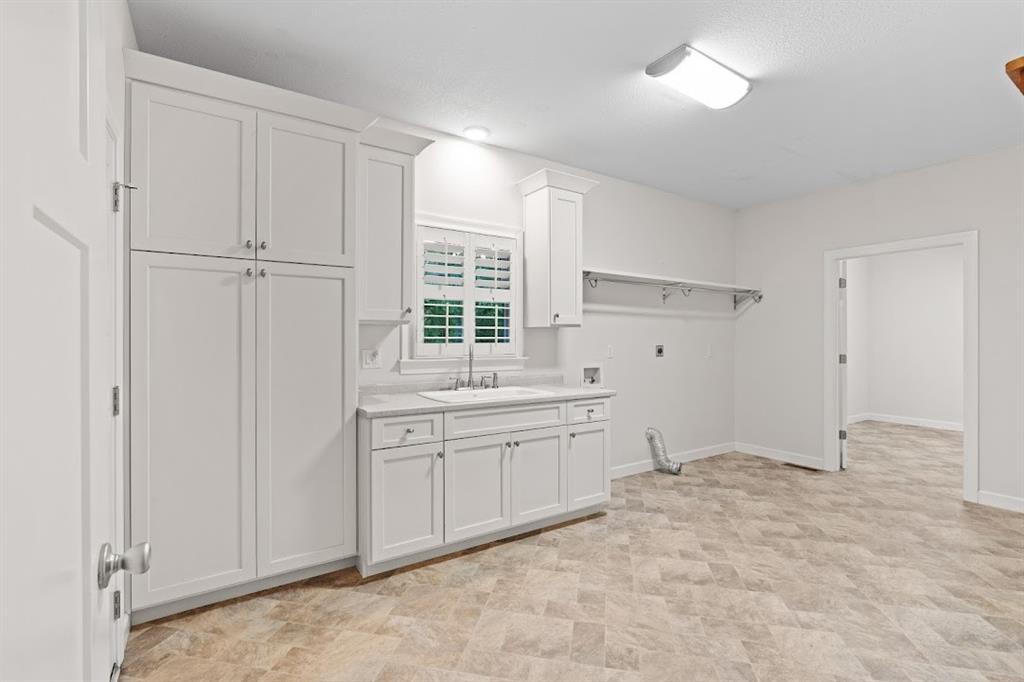 2239 Cross Roads Church Road Buchanan, GA 30113 - Photo 27 of 53 a spacious bathroom with a granite countertop sink mirror and a toilet