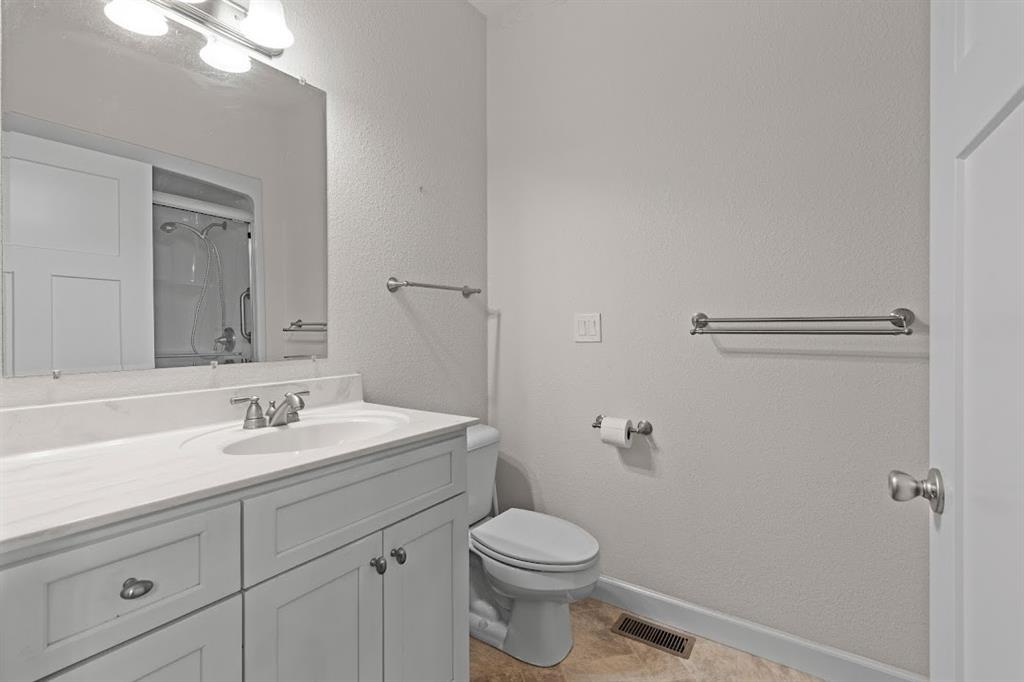2239 Cross Roads Church Road Buchanan, GA 30113 - Photo 33 of 53 a bathroom with a sink a toilet and a mirror