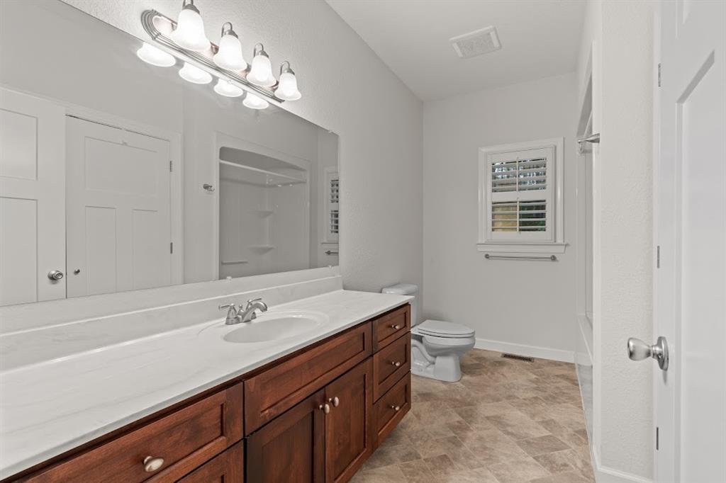 2239 Cross Roads Church Road Buchanan, GA 30113 - Photo 39 of 53 a bathroom with a sink a toilet and a mirror