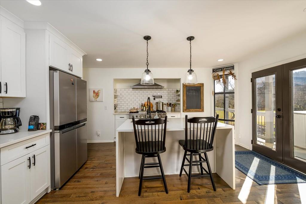 3274 Highway 255 Sautee Nacoochee, GA 30571 - Photo 16 of 77 a view of a dining room with furniture window and wooden floor