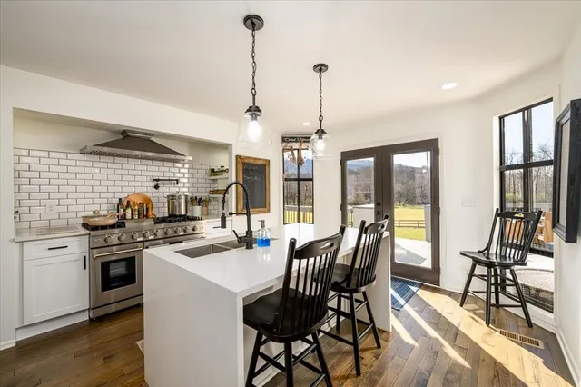 a white bath tub sitting next to a window