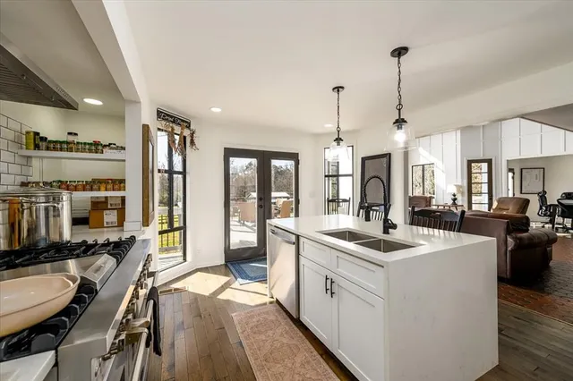 a bedroom with a large bed and a large window