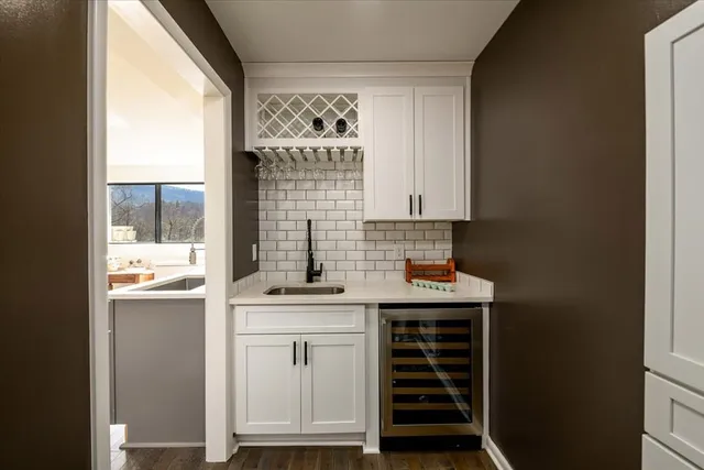 a bedroom with a large bed and a ceiling fan