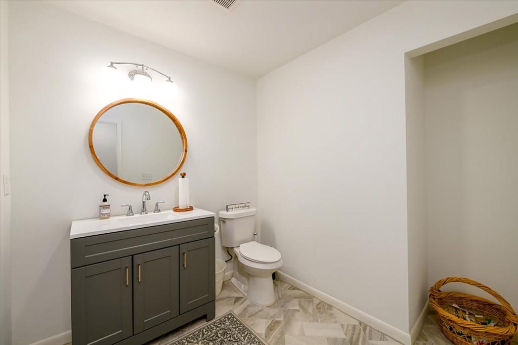 3274 Highway 255 Sautee Nacoochee, GA 30571 - Photo 24 of 77 a bathroom with a toilet a sink and a mirror