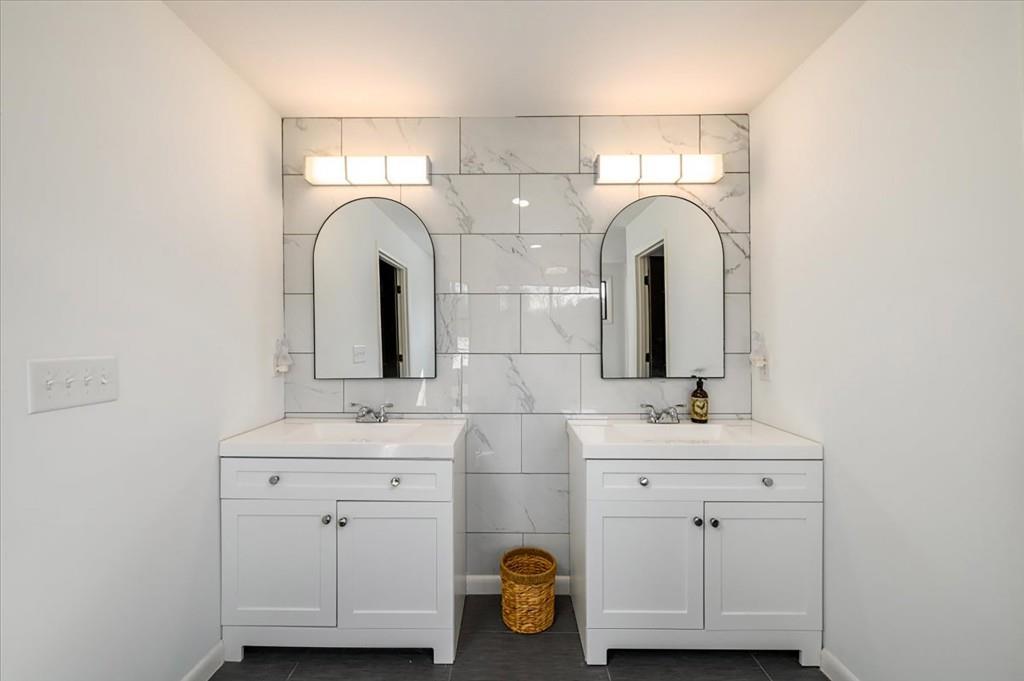 3274 Highway 255 Sautee Nacoochee, GA 30571 - Photo 27 of 77 a bathroom with a double vanity sink and a mirror