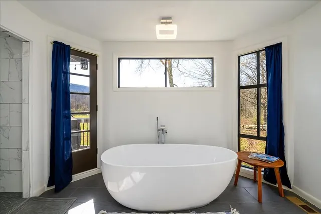 a view of balcony with couch and wooden floor