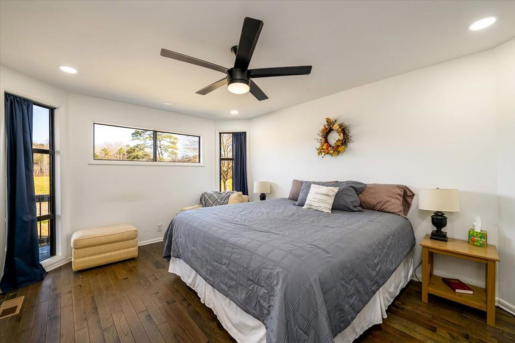 3274 Highway 255 Sautee Nacoochee, GA 30571 - Photo 35 of 77 a bedroom with a bed and a chandelier