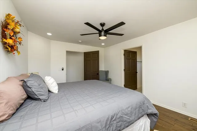 a bedroom with a bed and a dresser