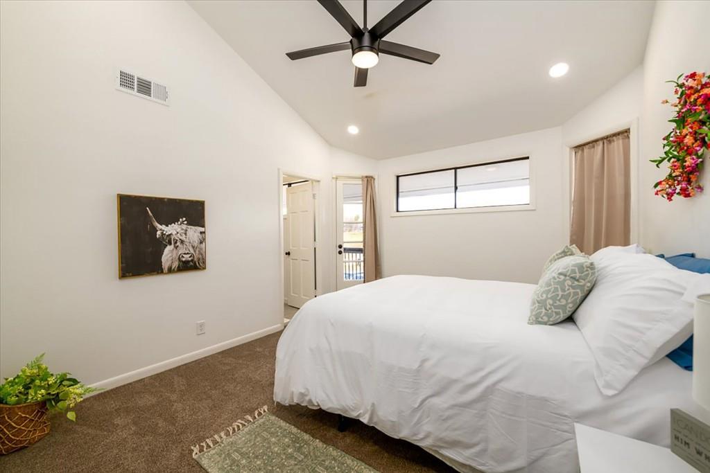 3274 Highway 255 Sautee Nacoochee, GA 30571 - Photo 38 of 77 a bedroom with a large bed and a chandelier