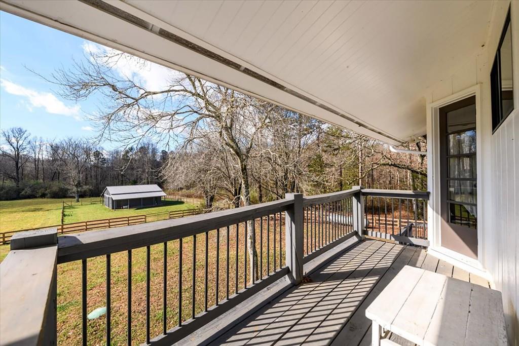 3274 Highway 255 Sautee Nacoochee, GA 30571 - Photo 47 of 77 a view of balcony with couch and wooden floor