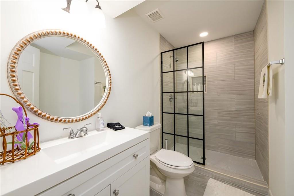 3274 Highway 255 Sautee Nacoochee, GA 30571 - Photo 48 of 77 a bathroom with a sink mirror toilet and shower