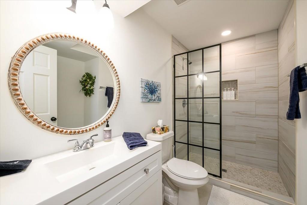 3274 Highway 255 Sautee Nacoochee, GA 30571 - Photo 65 of 77 a bathroom with a toilet a sink and mirror