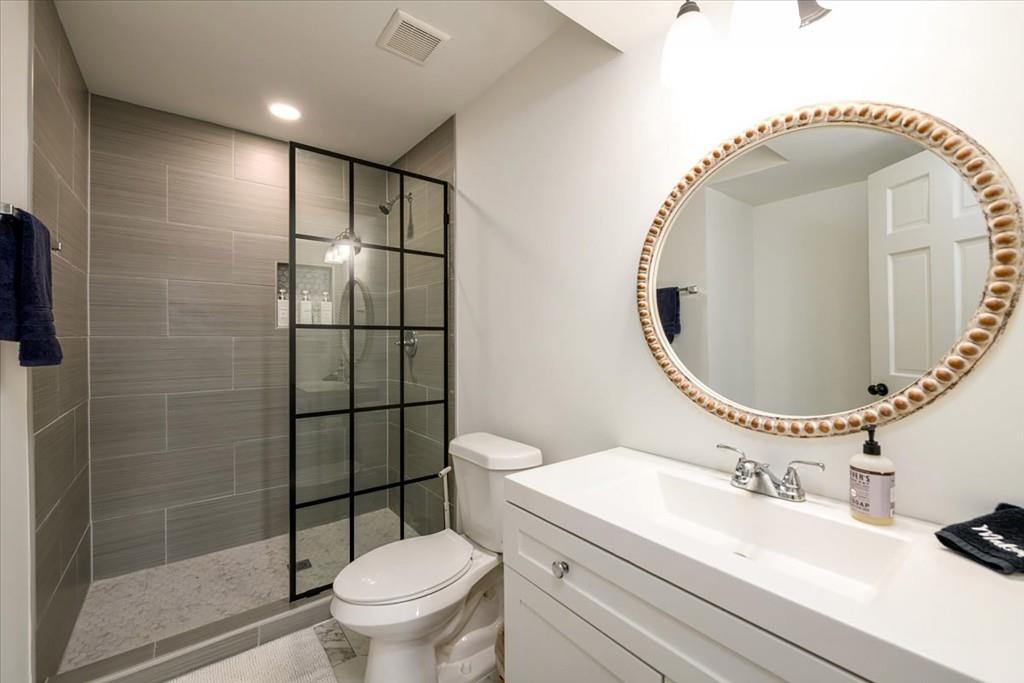3274 Highway 255 Sautee Nacoochee, GA 30571 - Photo 69 of 77 a bathroom with a sink a toilet and a mirror
