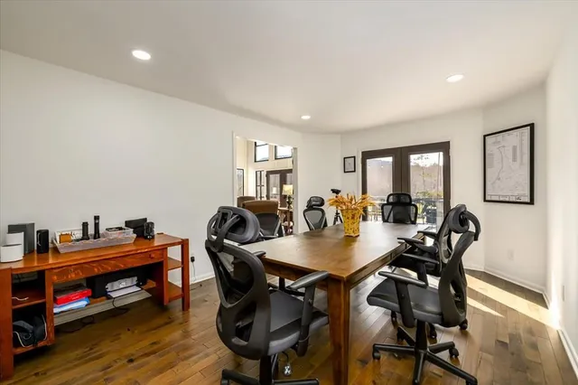 a view of a dining room with furniture kitchen and wooden floor