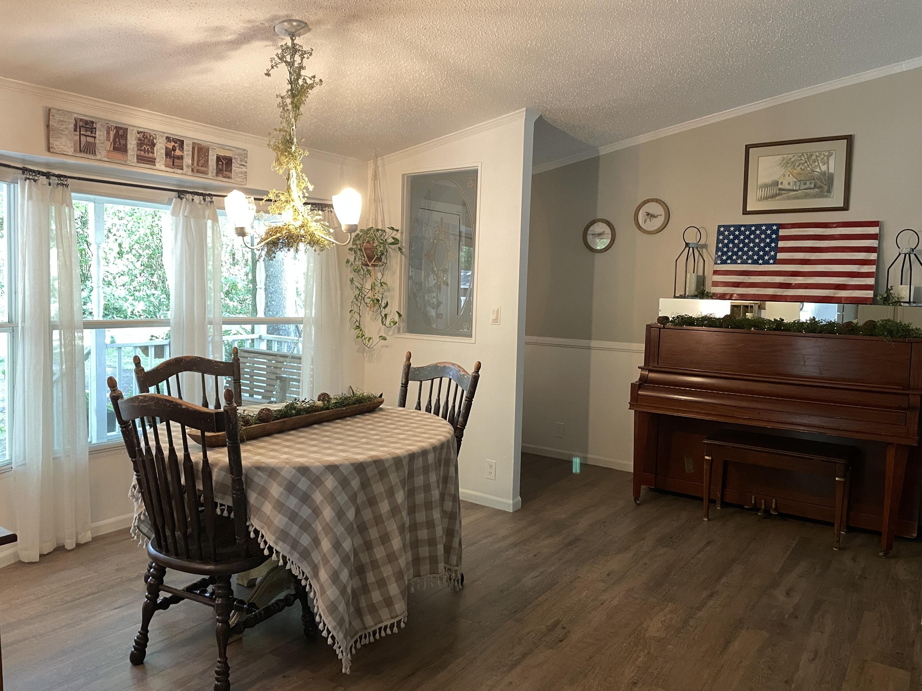 2166 Healing Springs Road Blackville, SC 29817 - Photo 4 of 43 a view of a dining room with furniture window and wooden floor