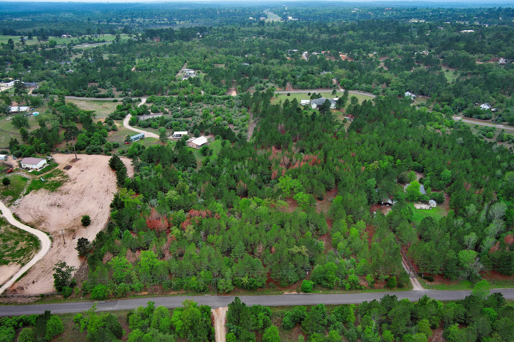 453 Kelley Road East Bastrop, TX 78602 - Photo 6 of 20 an aerial view of residential houses with outdoor space and trees