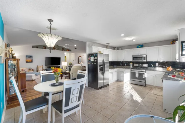 a white refrigerator freezer and a table