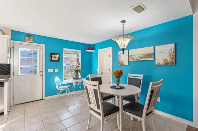 a view of room with furniture and wooden door