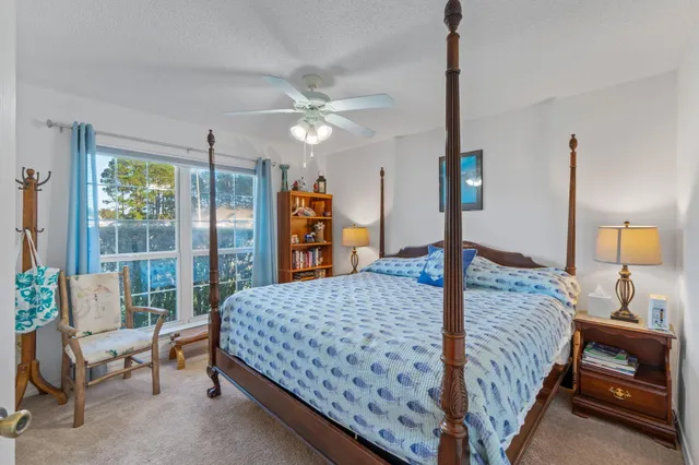 a bathroom with a sink a toilet and shower curtain