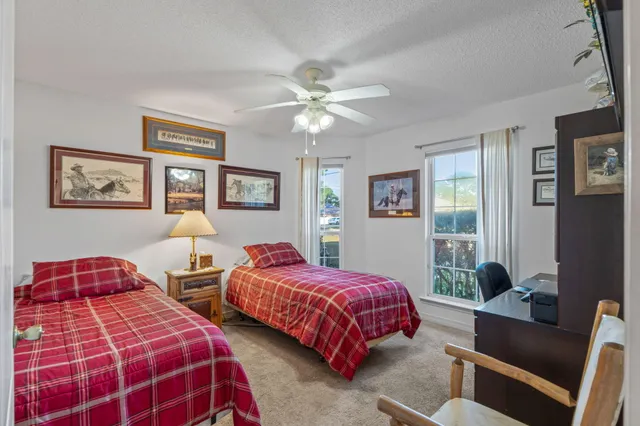 a bathroom with a shower toilet and sink