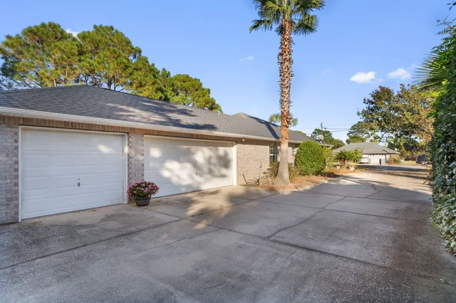 a view of a house with a yard and garage