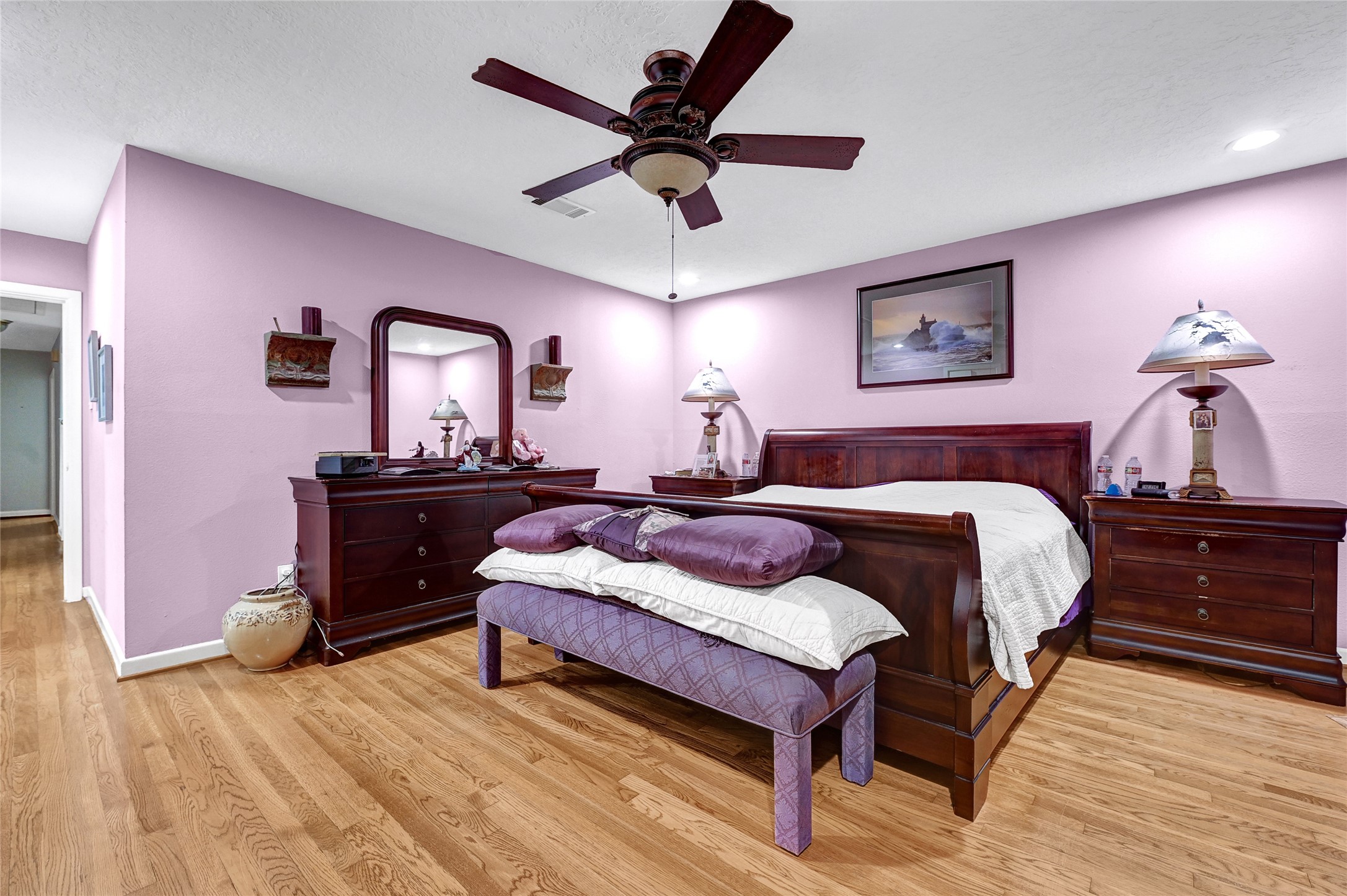 4831 Knickerbocker Street Houston, TX 77035 - Photo 41 of 50 decorated in light purple tones, featuring a large bed and matching furniture set.