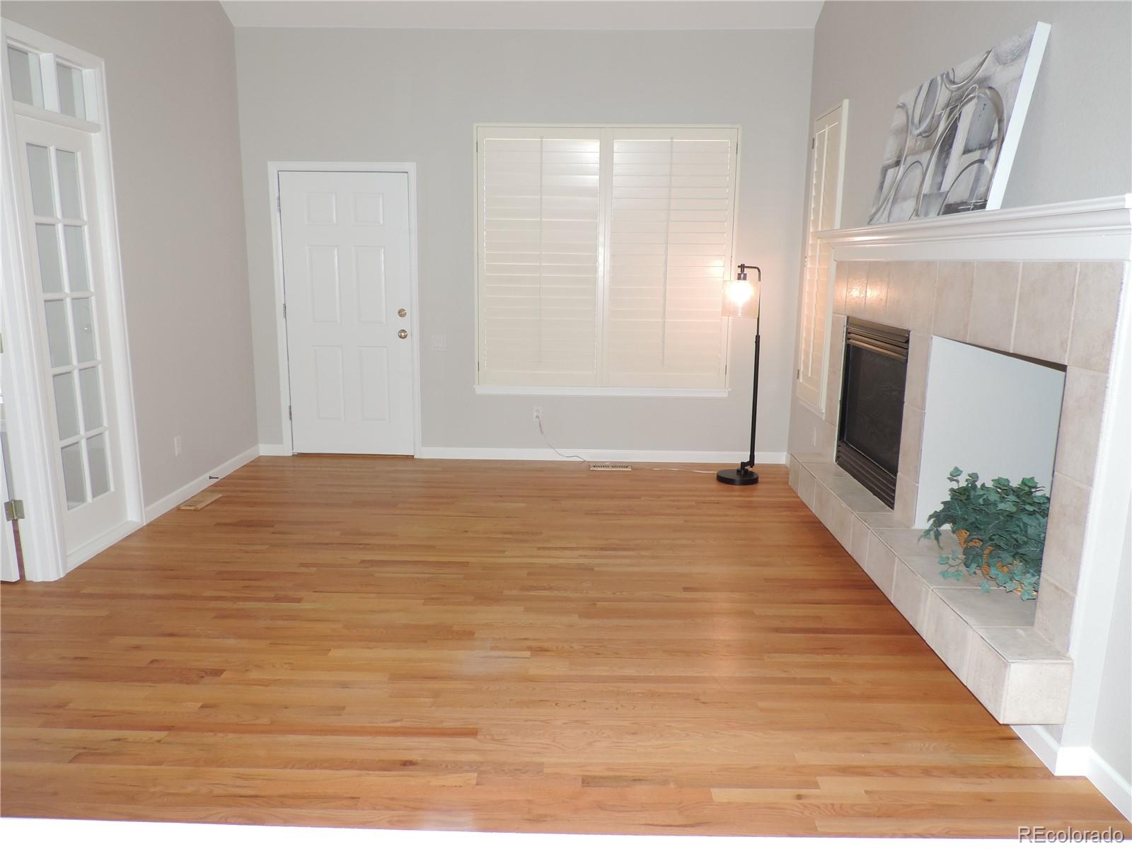 6239 Trailhead Road Highlands Ranch, CO 80130 - Photo 7 of 47 a view of empty room with window and fireplace