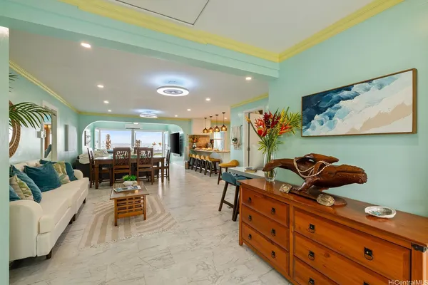 a living room with furniture and a flat screen tv