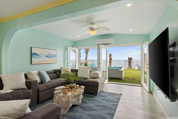 a living room with furniture and a flat screen tv